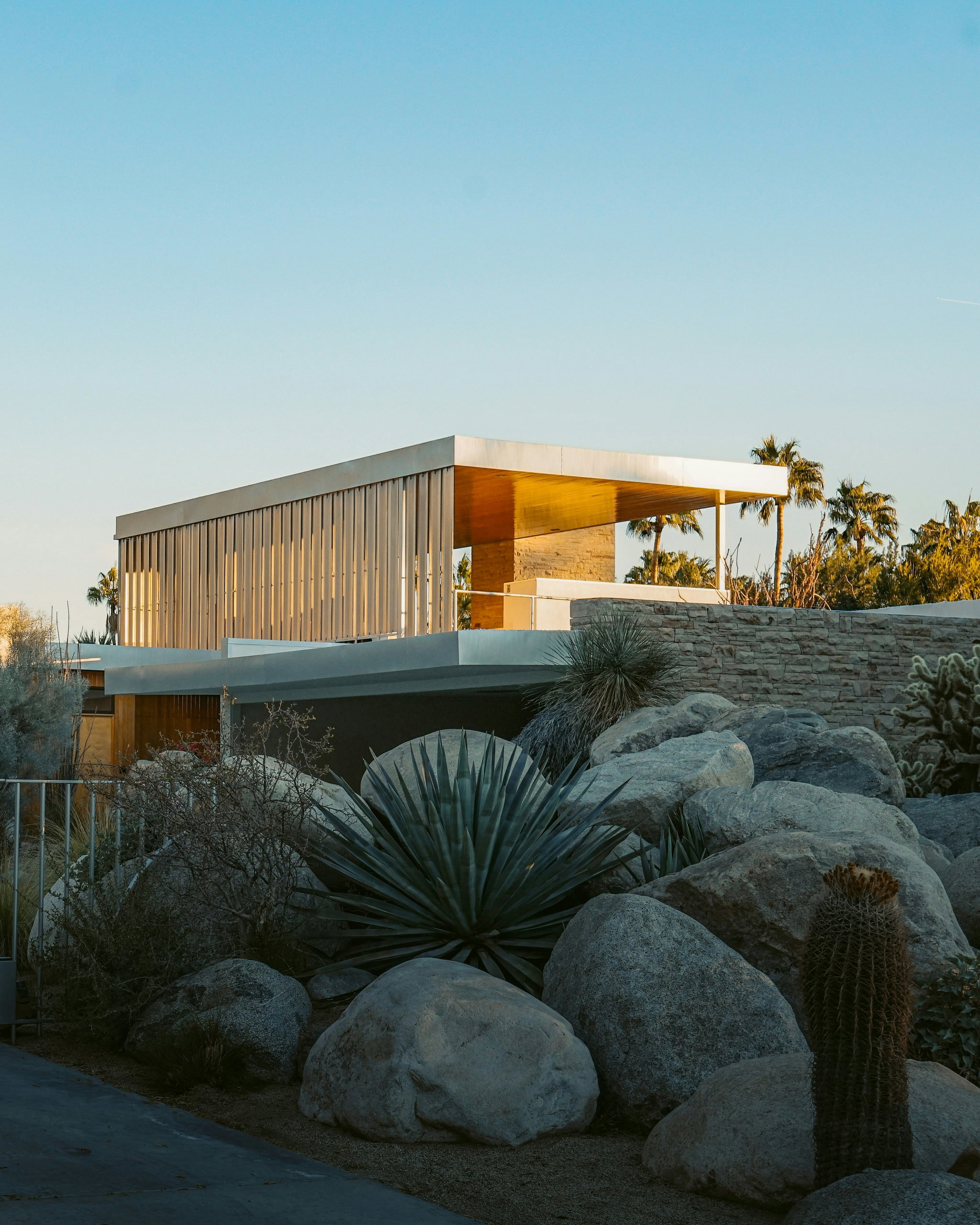 Brown wooden mid-century house among trees