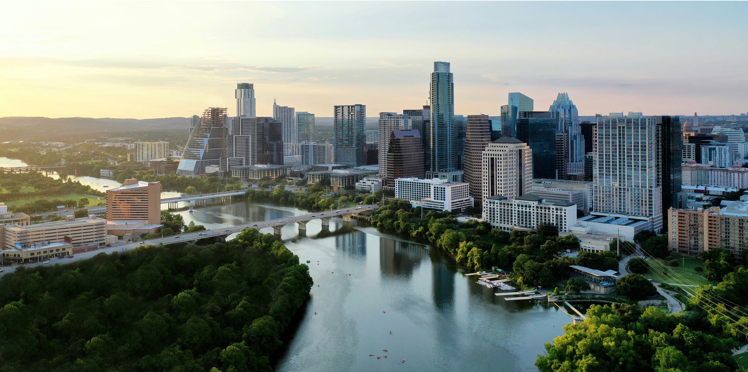 Aerial view of a city skyline with a river running through it